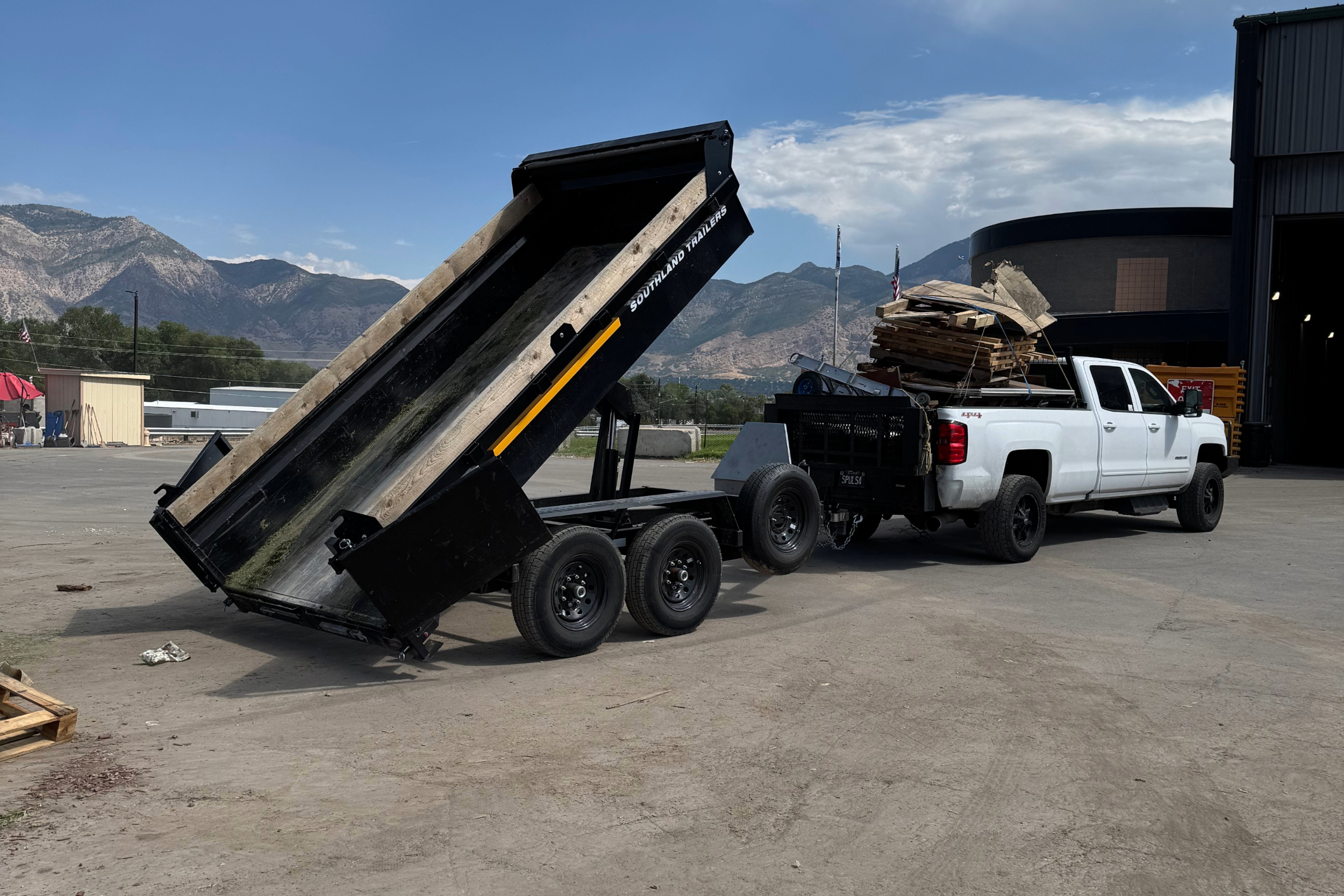 truck with dumping trailer at the dumps